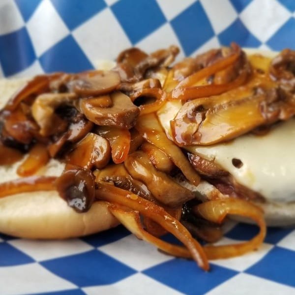 A Big Ray's burger with melted cheese, sautéed mushrooms, and onions on a bun.